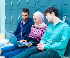 students looking at a laptop